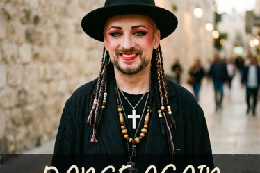 Smiling performer in black hat and makeup with Hebrew text, "שם נקרא" and "אנחנו נרקוד שוב"